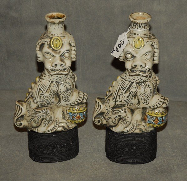 Pair of Foo dog licquer bottles. H: 11": Pair of Foo dog licquer bottles. H: 11"