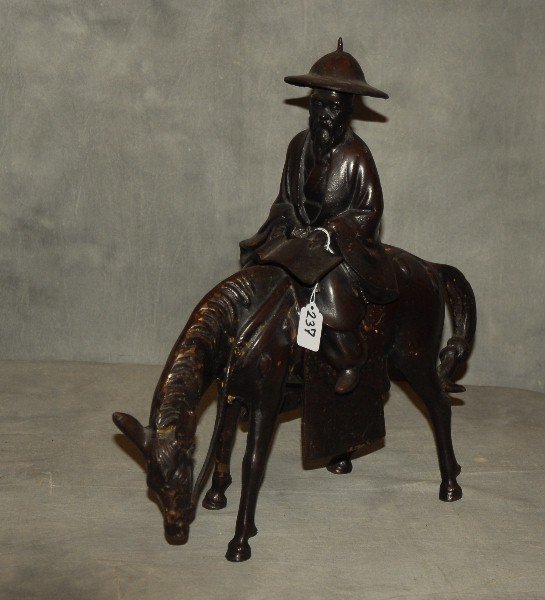 Japanese bronze figure of a horse and rider. H: 19" W:: Japanese bronze figure of a horse and rider. H: 19" W: 19"