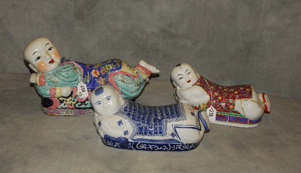 Three Chinese porcelain pillows. Largest: 9" x 17": Three Chinese porcelain pillows. Largest: 9" x 17"