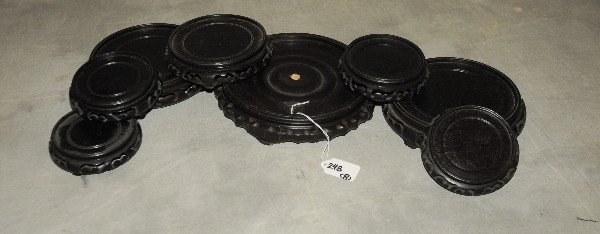 8 Chinese carved hardwood stands. Largest: 8.25": 8 Chinese carved hardwood stands. Largest: 8.25" Smallest: 4"