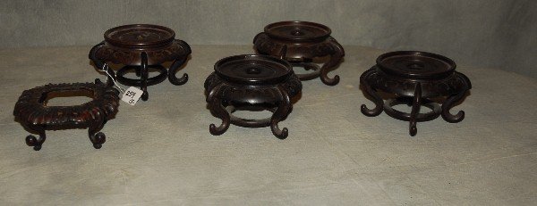 5 Antique Chinese carved hardwood stands. Largest H:: 5 Antique Chinese carved hardwood stands. Largest H: 3.75" D: 7"