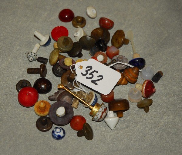 Bag of Chinese Snuff Bottle Tops: Bag of Chinese snuff bottle tops.