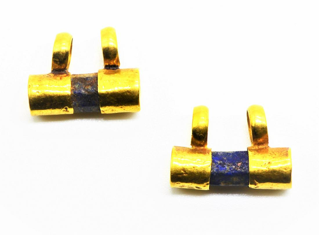 PAIR OF ANCIENT EGYPTIAN/ROMAN LAPIS LAZULI GOLD: A RARE PAIR OF ANCIENT EGYPTIAN/ROMAN LAPIS LAZULI GOLD EARRINGS OR PENDENTS, Circa 2nd century BC - 3rd century AD.Pair of Earrings with lapis lazuli beads from the Ptolemaic to Roman period. The cyl
