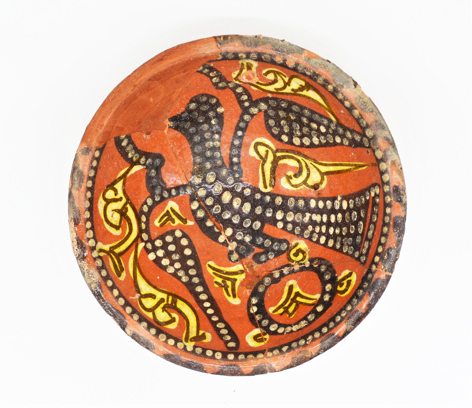 A BEAUTIFUL ISLAMIC NISHAPUR RED SLIPPED BIRD BOWL: A BEAUTIFUL ISLAMIC NISHAPUR OR SAMARQAND RED-SLIPPED BOWL, ABBASID SAMANID PERIOD CIRCA 10TH CENTURY. Of red-slipped bowl featuring a stylised bird decorated with black with geometric white Dots and 