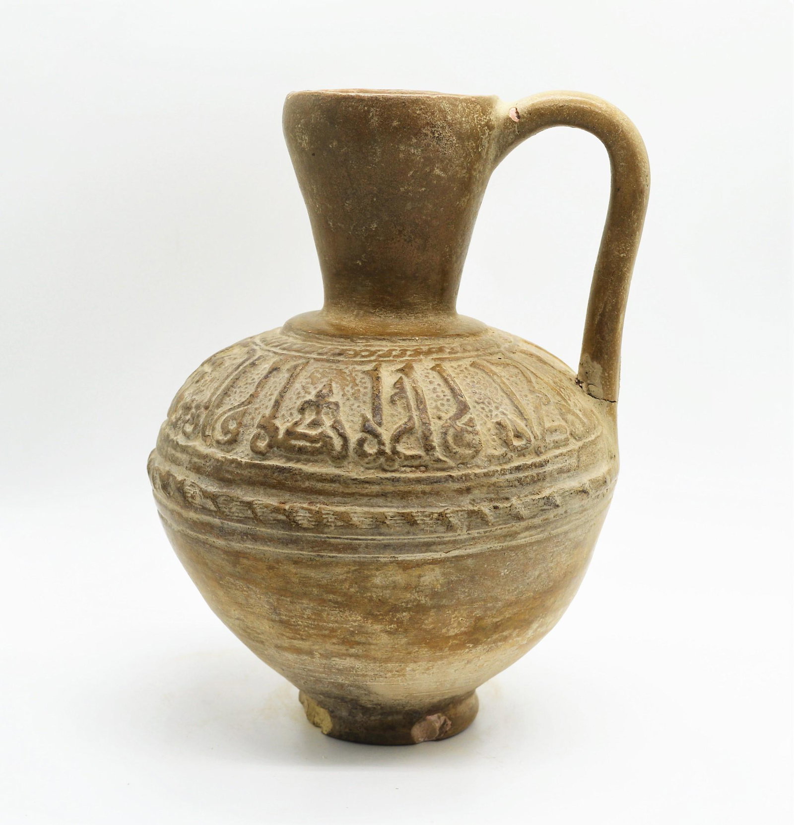 ISLAMIC SELJUK CALLIGRAPHIC POTTERY JUG: ISLAMIC SELJUK CALLIGRAPHIC POTTERY JUG, CIRCA 11TH-12TH CENTURY.