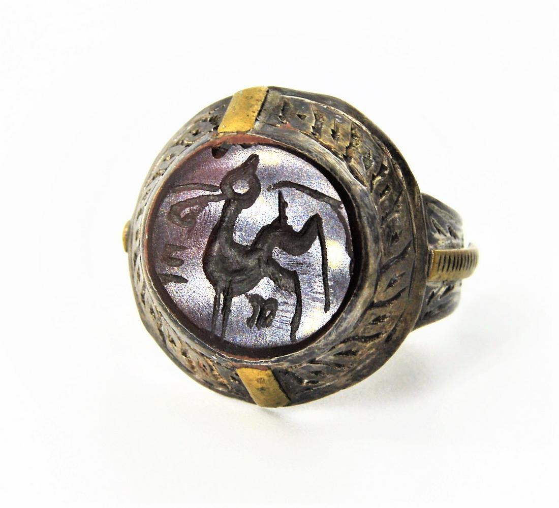 ISLAMIC PERSIAN CARNELIAN SILVER RING WT IMAGE OF DEER: A Rare Antique Islamic Persian Carnelian Silver Ring , Circa Possibly 19th Century , With Beautiful Islamic Style Design , And withSeal of Deer Image, Similar to Sassanian Style Seals.