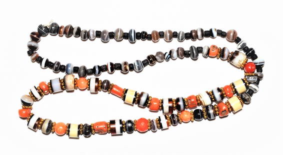 ANCIENT SULAIMANI BANDED AGATE BEADS NECKLACE: A Rare Ancient Agate Suleimani Dzi Chung Beads Necklace around 1500+ years old, With Antique Coral. A conversation with a Tibetan from Lhasa revealed that beads weredeliberately chipped either as