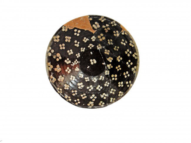 A SAMANID GLAZED POTTERY BOWL ,CENTRAL ASIA 10TH CE: Earthenware, with slip decoration in white on black, under a transparent glaze Meaurment :