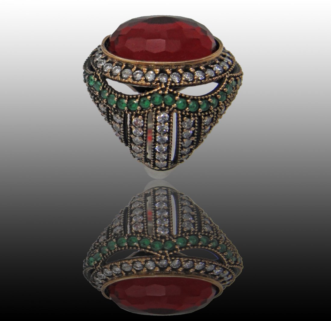 A Faux Ruby & Emerald Sterling Silver Ring: A Large Sterling Silver Ring With Ruby & Emerald Color Stones .
