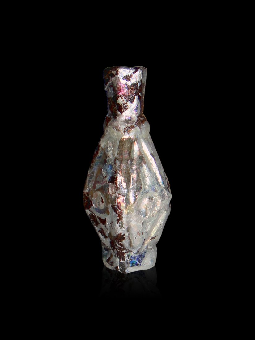 A Rare Islamic Wheel Cut Glass Bottle 9th-10th Century: A Unique Islamic Wheel-Cut Small Glass Bottle Iran Persia or Central Asia 9th/10th Century , In Wheel Cut From the Top to the Bottom , Having A Unique Eye Design in Cut Around the Bottle , With Full P