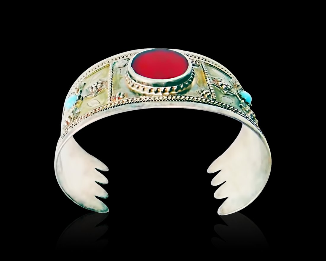 A Bukhara Silver & Gilt Bracelet 19th Century: A Beautiful Islamic Bukhara Silver & Silver Gilt Bracelet Central Asia or Uzbekistan 19th Century , With Carnelian or Red Glass in the middle and Wonderful Work , Turquoise Stone on Both Sides .