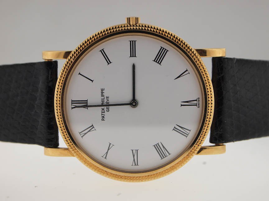 Patek Philippe Mens 18k Gold Calatrava. Lizard Str: Patek Philippe Mens 18k Gold Calatrava. Lizard Strap. Patek Philippe, Mens, 18k Gold, Calatrava, Original Lizard Strap, Mechanical Movement, Swiss Made, Beautiful Condition, Pre-Owned.