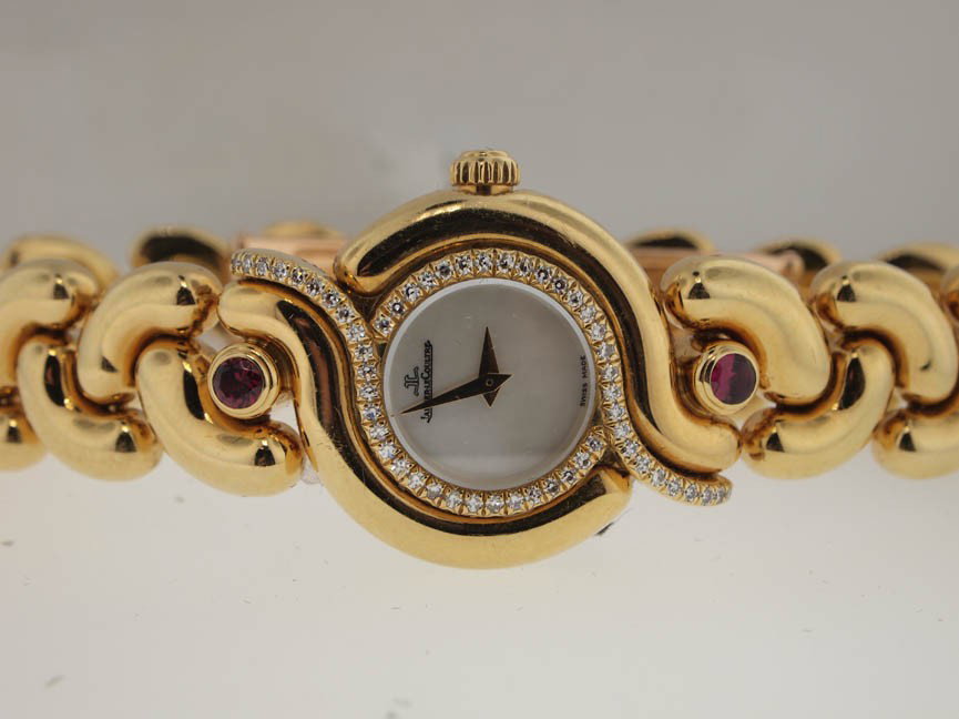 Jaeger-LeCoultre Ladies 18k Diamond and Ruby Dress : Jaeger-LeCoultre Ladies 18k Diamond and Ruby Dress Watch. 30k Retail. Jaeger-LeCoultre, Ladies, 18k Gold, Diamond and Ruby, Retail Aprox $30k, Dress Watch, Deployment Buckle, Swiss Made.