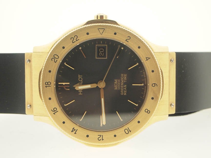 Hublot Mens/Midsize 18k Gold Classic GMT.: Hublot Mens/Midsize 18k Gold Classic GMT. Hublot, Mens/Midsize, 18k Gold, Classic, Date, GMT, Automatic Movement, Swiss Made.