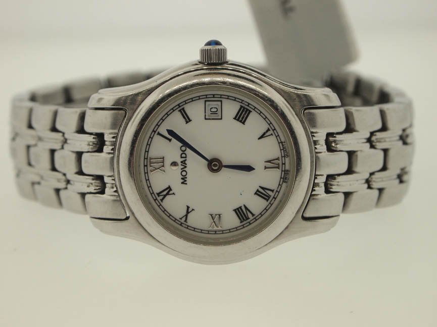 Movado Ladies Stainles Steel Watch. White Dial.: Movado Ladies Stainles Steel Watch. White Dial. Movado, Ladies, Stainless Steel, White Dial, Roman Numeral, Date, Quartz Movement, Swiss Made.