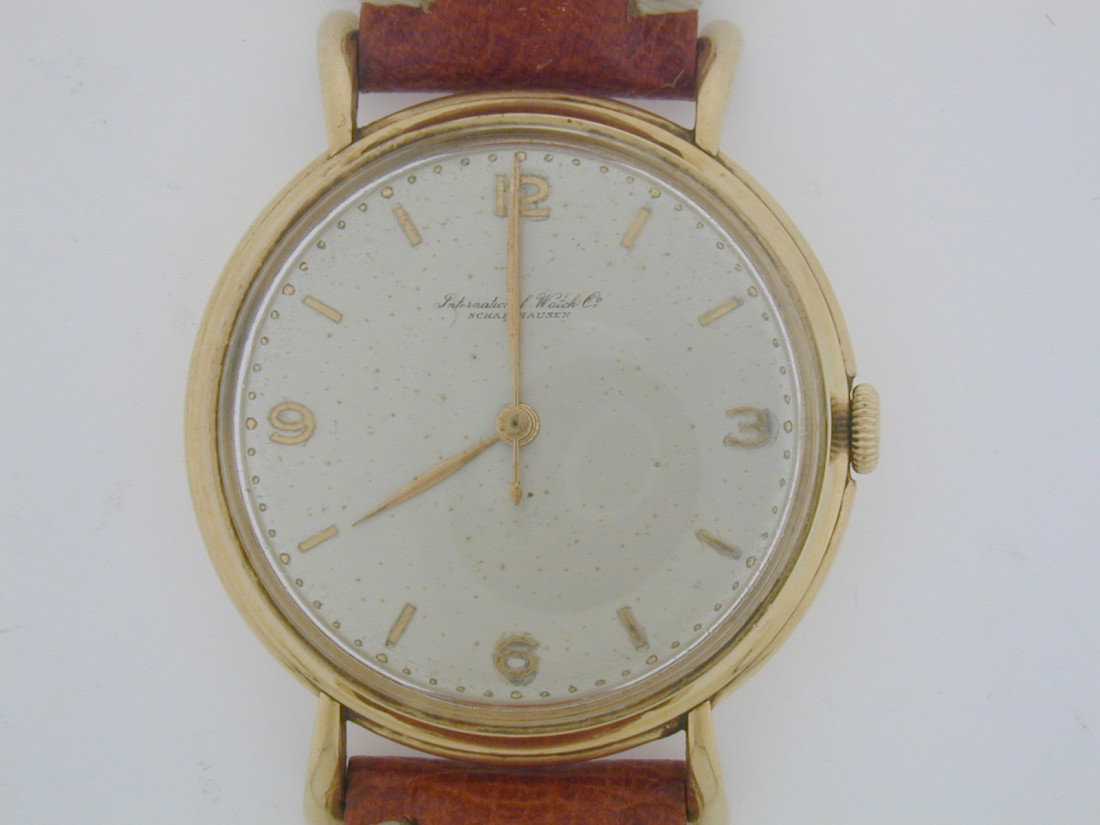Vintage International Watch Co. Gents watch: Rare gents IWC 18k YG case Very clean Fancy lugs Cal .89 Swiss winding movement. Watch all original, with new tan leather band.