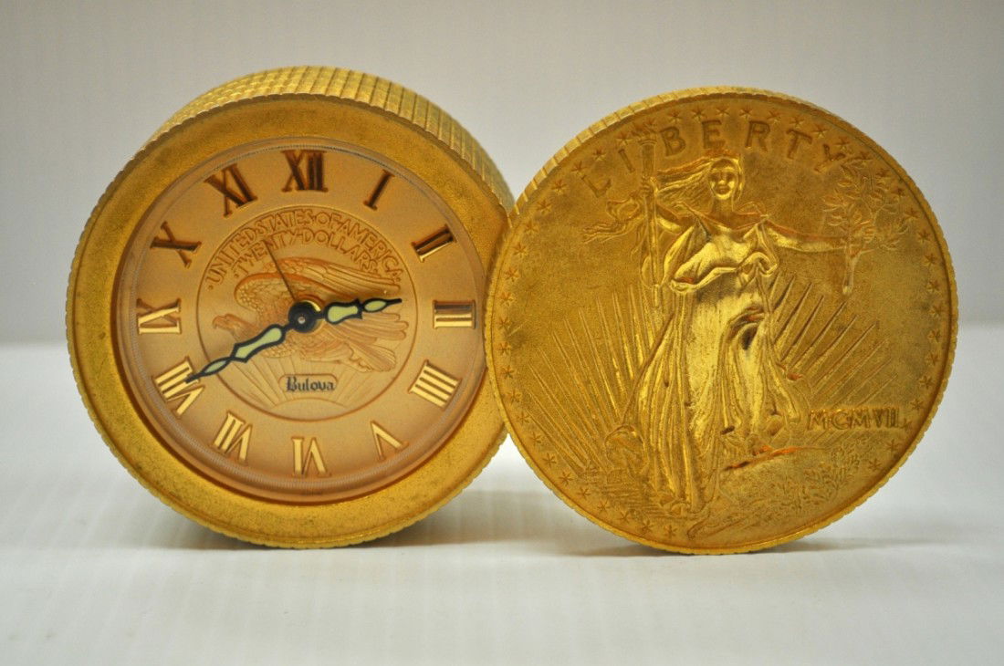 VINTAGE BULOVA TWENTY DOLLARS ALRM CLOCK: BULOVA UNITED STATES OF AMERICA TWENTY DOLLARS EAGLE DESK ALRM CLOCK IT IS 3" BY 1-3/4" THE TOP SWIVELS SHUT.