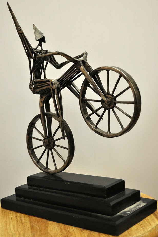 RAFAEL CONSUEGRA CUBAN SCULPTURE: RAFAEL CONSUEGRA CUBAN SCULPTURE ORIGINAL STAINLESS STEEL SCULPTURE ON WOOD "CICLISMO" OR THE BICYCLIST 15' X 6" X11"