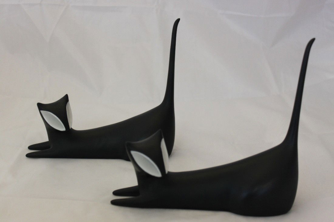 A pair of two Royal Dux black cats: Pair of Royal Dux Mint condition. Black & Whitecats, made out of porcelain. Approx 7.5" tall.