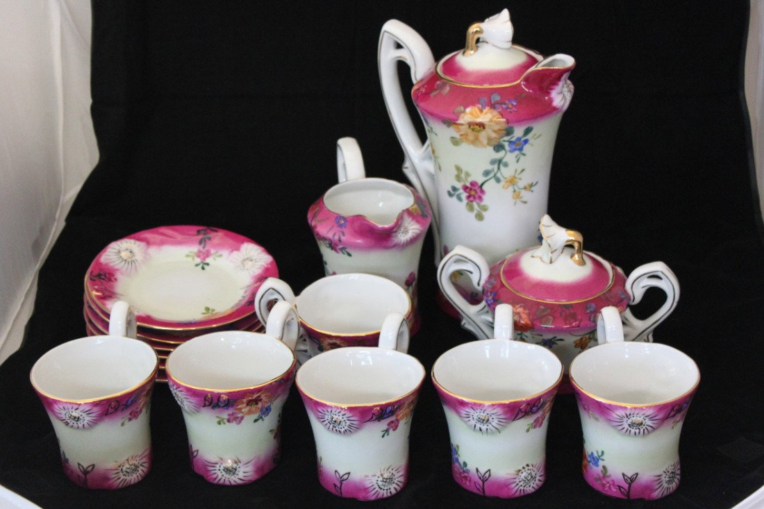 limoges china Hot Chocolate set 15 piece set: This is a unique set of limoges China. It comes with 15 pcs. 6 cups, 6 plates, 1 big pot, 1 small pot and one small jar Mint condition, and the big pot measures Approx 10" Tall. And cups measure 3.5"