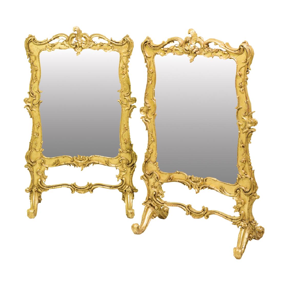 A PAIR OF ROCOCO STYLE CARVED GILTWOOD AND GESSO: A PAIR OF ROCOCO STYLE CARVED GILTWOOD AND GESSO FIRESCREENS. LATE 19th CENTURY. 104 x 65 x 35.5 cm