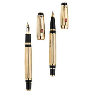 A MONTBLANC BOHEME fountain and rollerball pen set.: A MONTBLANC BOHEME fountain and rollerball pen set. Gold plated silver.