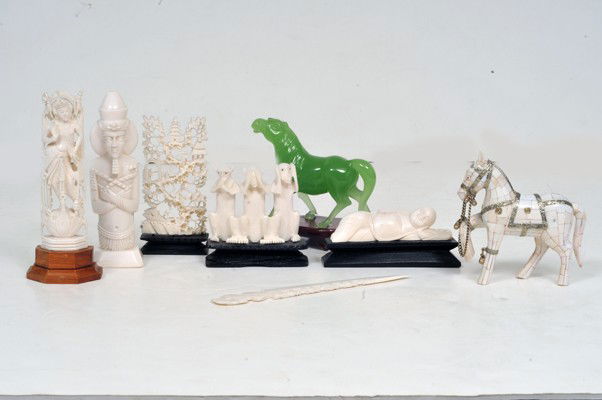 Decorative art objects: a) Letter opener. Made in bone. Design draft. B)Horse, made on wood and bone plates, Height: 11 cms. Pharaoh, made on ivory, height: 15 cms. D) Three monkeys, made on ivory. Wood base, height: 9cms, f