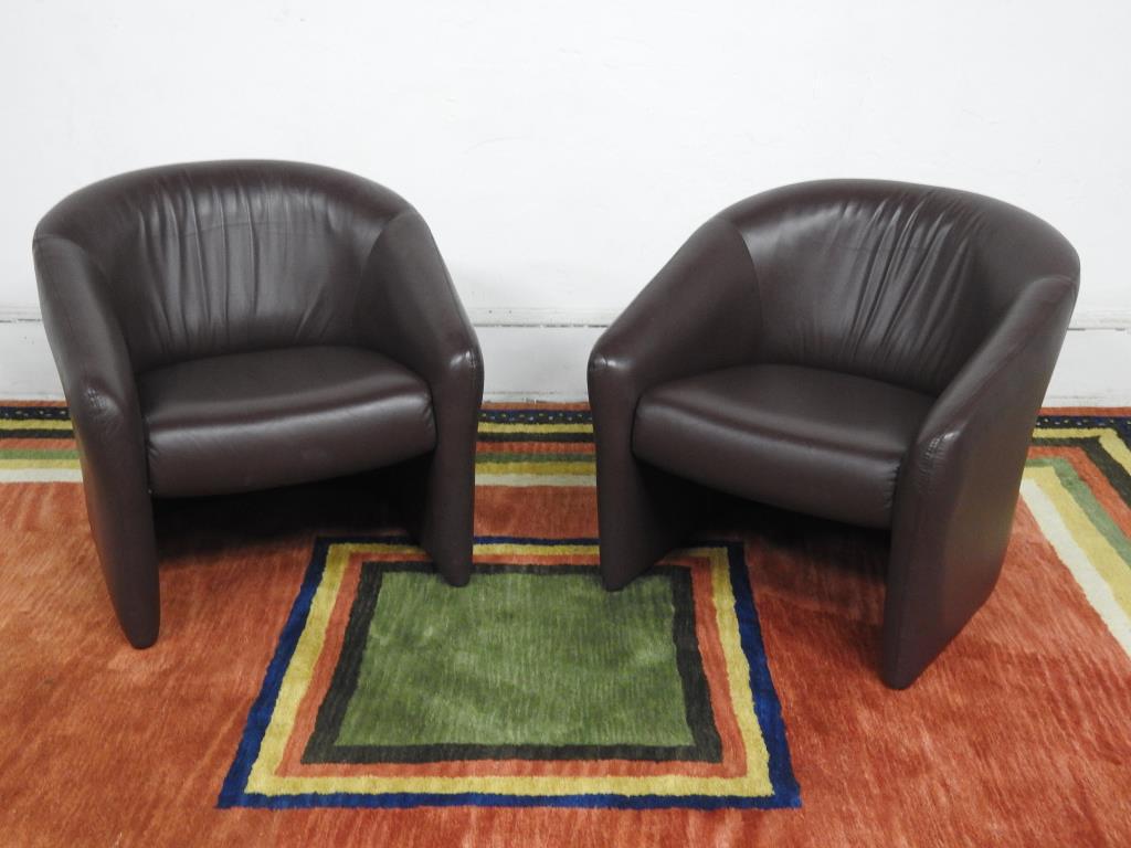 Pr. of Karl Spinger Style Leather Lounge Chairs: Brown leather "c" form lounge chairs. In good condition. 28"H X 29"W X 31"D.