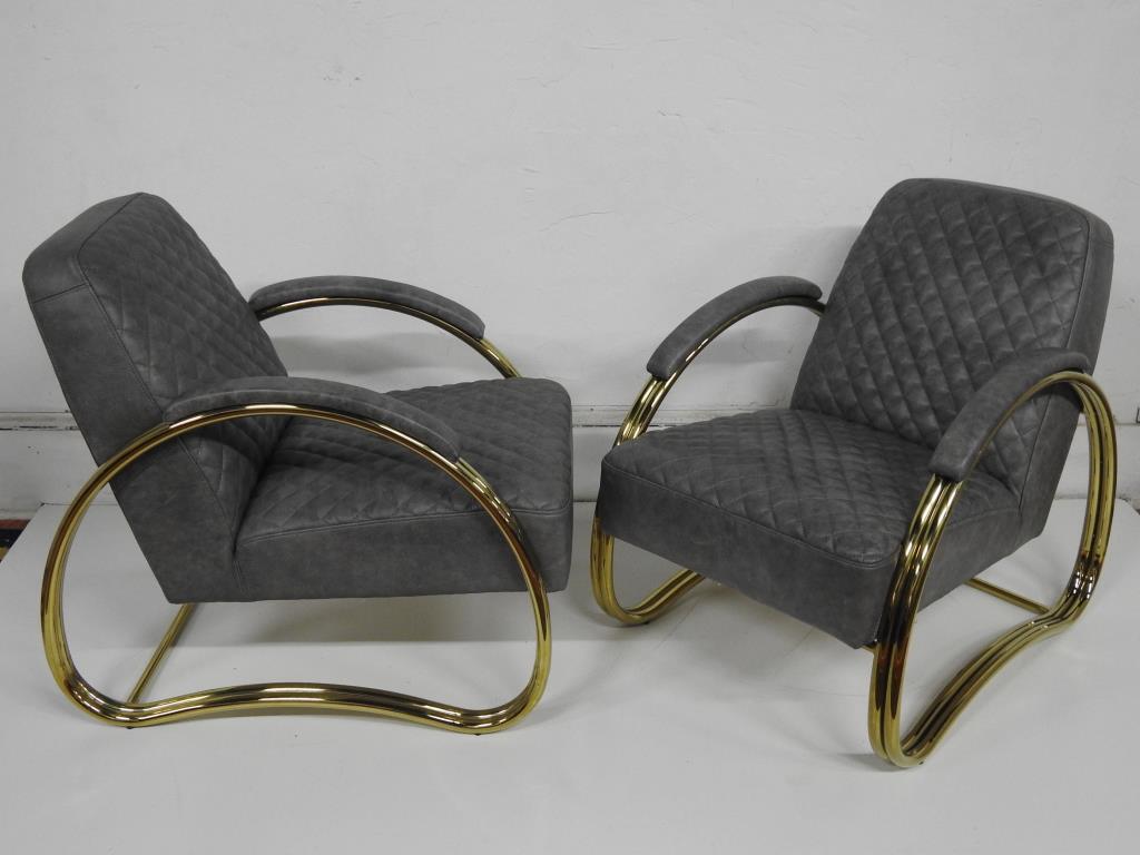Pr of. Art Deco Style Leather Lounge Chairs: Classic double brass tube frame construction with waffle tufted grey leather covering. in good condition. 31"H X 25"W X 34"D.