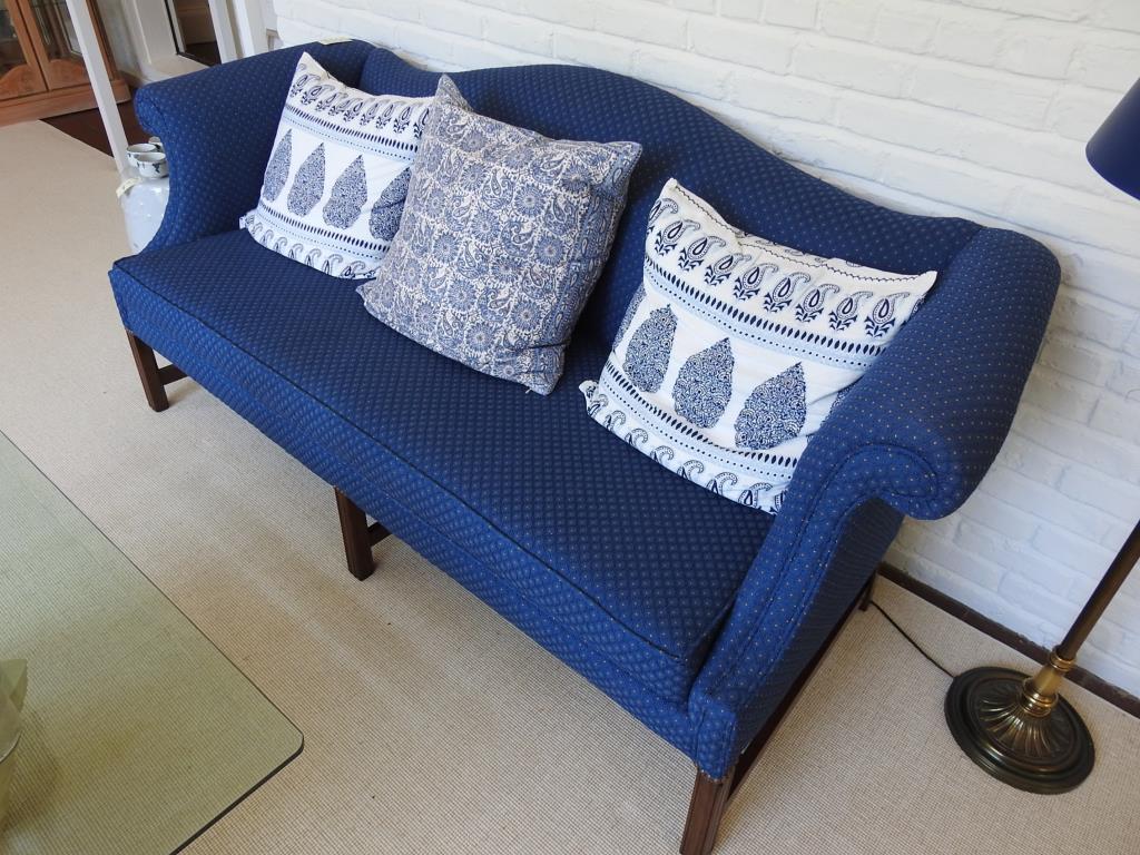 Camelback Sofa: Camelback sofa with mahogany frame and a blue fabric covering. Sofa is in good condition. Measurements are 34"x76"x22" with a seat height of 18".