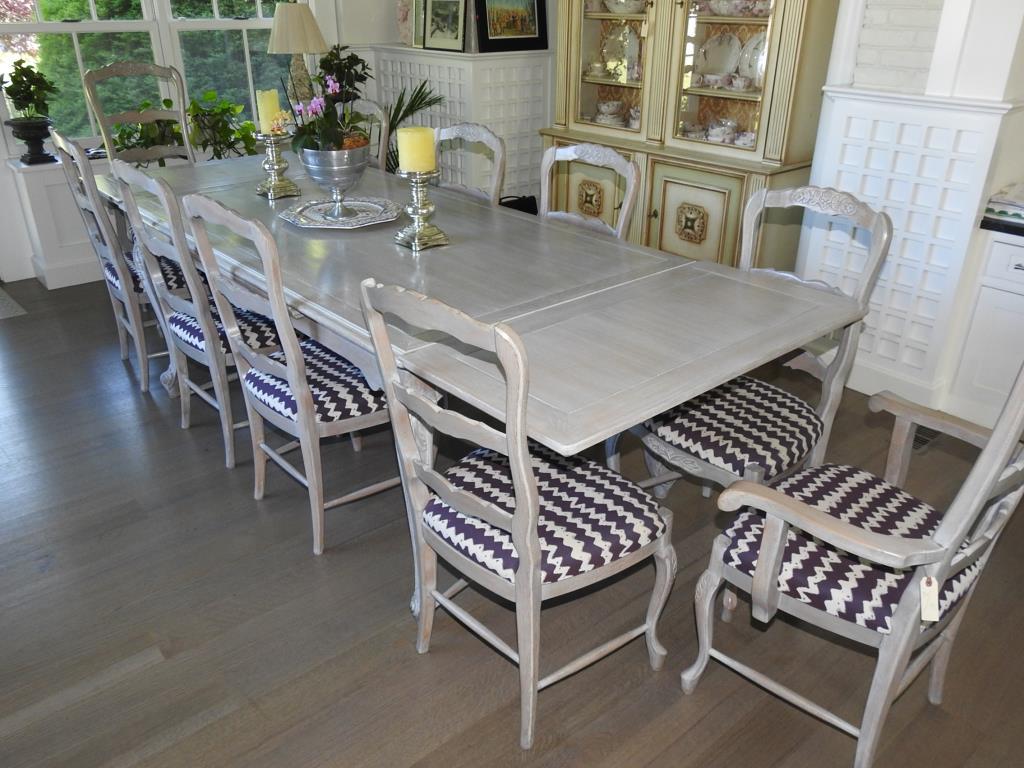 Country French Table And Chairs: Country french refractory table with eight side chairs and two arm chairs. Chairs have minor cracks and repairs, otherwise, lot is in good condition. Measurements for the table are 70"x42" and opens t
