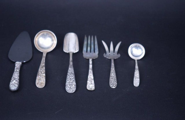 6 Kirk Assorted SS Flatware Pieces: 6 Kirk Assorted Sterling Silver Flatware Pieces. 1-nut spoon, 1-serving fork, 1-large ladle, 1-small ladle,1-fish fork. 5.30 TO. Also, a cake knife, mostly Repousse Pattern.