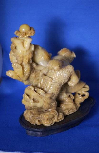 Fine Yellow Soapstone Carving: Fine Yellow Soapstone Carving of archaic animals raising from ocean10"h. X 8-1/2"w. X 5"d.