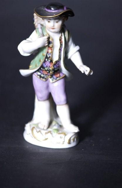 Meissen Figure of a Farm Worker: Meissen Figure of a Farm Worker, minor loss to the left hand, cross swords mark on base. 4-3/4" h.