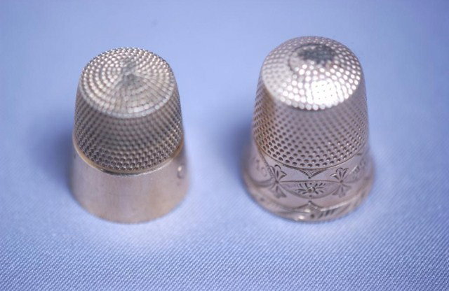2 Thimbles: 2 Thimbles, 1-large 10K gold and engraved, 1-9K gold and engraved, 9. grams total.