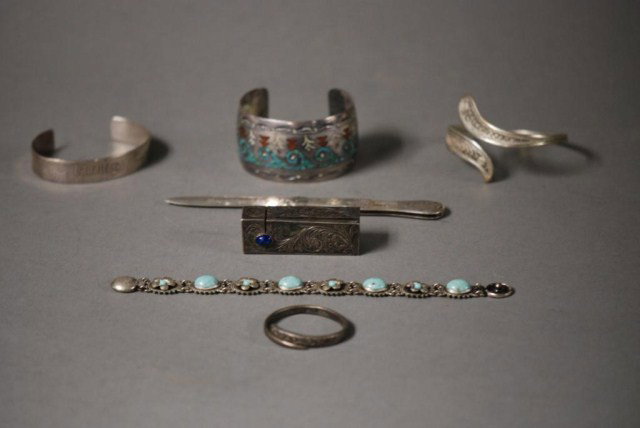 7 SILVER ITEMS: 7 Silver Items, 1-Singer, stone mounted bracelet, 1-turquoise mounted bracelet, 2-shaped bracelets, 1-baby bracelet, 1-engraved knife, 1-blue stone mounted lipstick case.