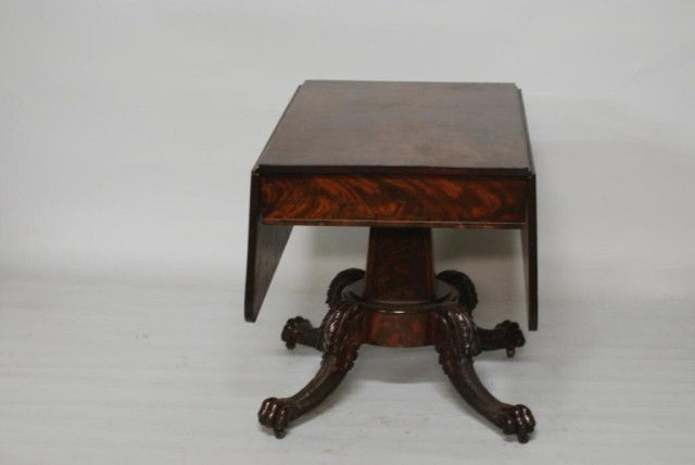 ANTIQUE DROP LEAF TABLE: Antique American Empire Drop Leaf Table, mahogany with hairy paw feet, in good condition.
