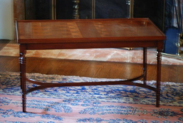 SHERATON STYLE COFFEE TABLE: Sheraton Style Yew Wood Coffee Table, ewe wood patchwork top with 4-fluted legs and a double cross stretcher, in good condition.