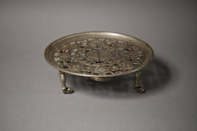 HEATING TRIVET Heating Trivet, possibly Russian 88: HEATING TRIVET Heating Trivet, possibly Russian 88,89 on the bottom, 4 legs with casters, top tray splits in middle to expose the burner.