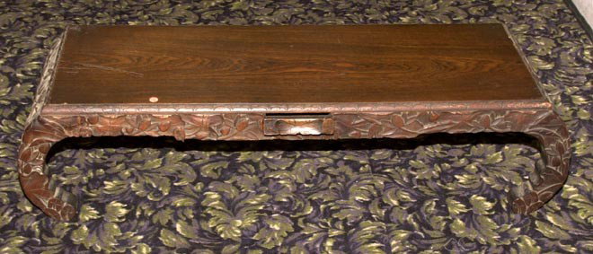 CHINESE CARVED COFFEE TABLE: Chinese Carved Coffee Table with one drawer, early 20th C., drawer is loose on runners, 12" high X 45" wide X 16" deep.
