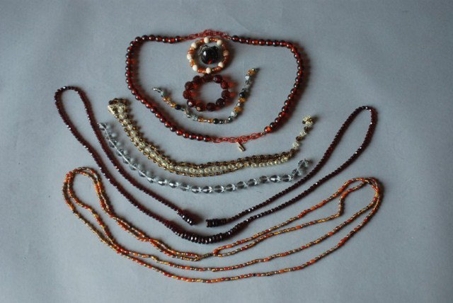 9 PC. BEADED COSTUME JEWELRY GROUP: Belts, necklaces, bracelets, and a ring. In good condition.