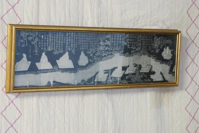 ANTIQUE CHINESE FRAMED FOLDING SCREEN: Black and white screen in a gilt frame, 12"H x 45"W. In good condition.