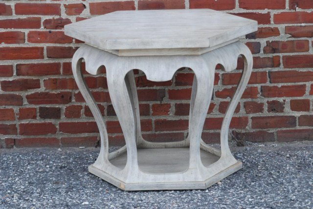 MID-CENTURY MODERN OCTAGON TABLE: In the manner of James Mont, 30"W x 26"D x 24"H. Molded wood frame with distressed finish. In good condition with minor rubs and losses.