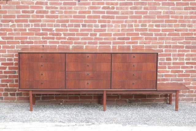 MID-CENTURY MODERN SIDEBOARD: Teak with 9 drawers, 6 legged base and side shelf, 96"W x 33-3/4"H x 18"D. In good condition,