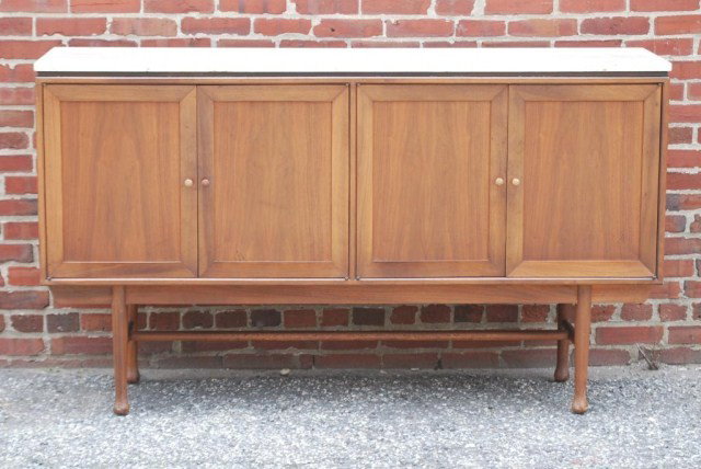 MID-CENTURY MODERN TEAK CABINET: 4 Doors, 2 sides each enclosing 1 drawer over a shelf. Top is made from Italian Travertine marble. In good condition.