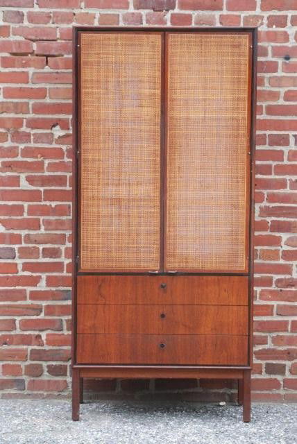 MID-CENTURY MODERN ROSEWOOD CHIFFONIER: 2 Caned doors over 3 drawers. There are 2 shelves inside the top cabinet, 31-1/2"W x 66"H x 16"D. In good condition.