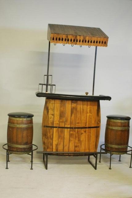 3PC. INDUSTRIAL DESIGN BAR SET: Iron frames with applied wood to create a barrel appearance, 2-vinyl covered stools and a hooded formica top bar with inset ice bucket, bar measures 41"W x 79"H x 20"D, stools measure 28 12"H x 14 1/2