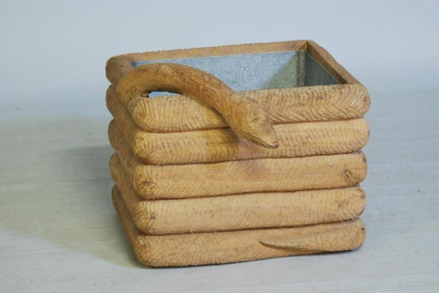 FANTASY FURNITURE PLANTER: Carved wood snake form planter box with lead liner, 21 1/2"W x 16"H x 23"D. Unfinished, in good condtion.