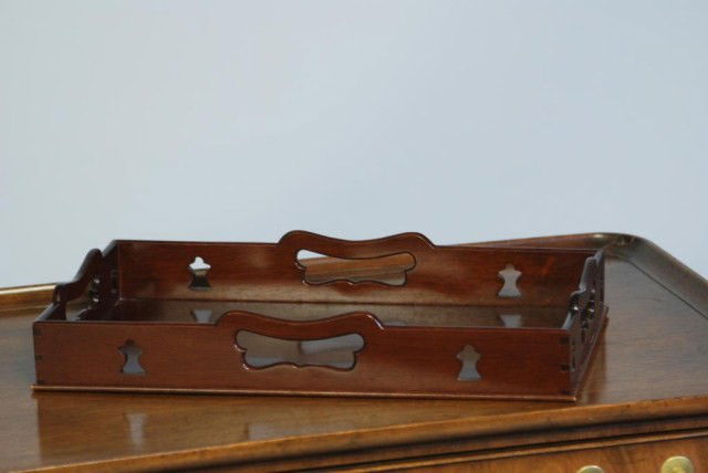 C.W. KITTINGER TABLE TOP TRAY: Mahogany with galleried top, 16"W x 2 1/4"H x 9 1/2"D. In good condition.