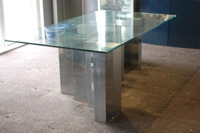 PAUL EVANS CITYSCAPE GLASS TOP TABLE: Metal patchwork abstract base with plate glass top, base separates into two sections, 28 1/2"h x 84"w x 48"d. In good "as found" condition.